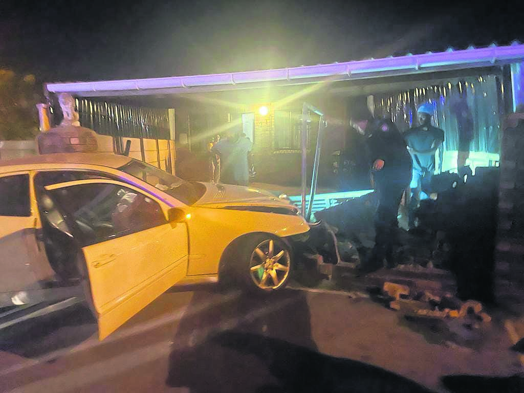 A woman was arrested, and two men escaped cops after the hijacked vehicle they were driving crashed into a wall in Gugulethu over the weekend. 