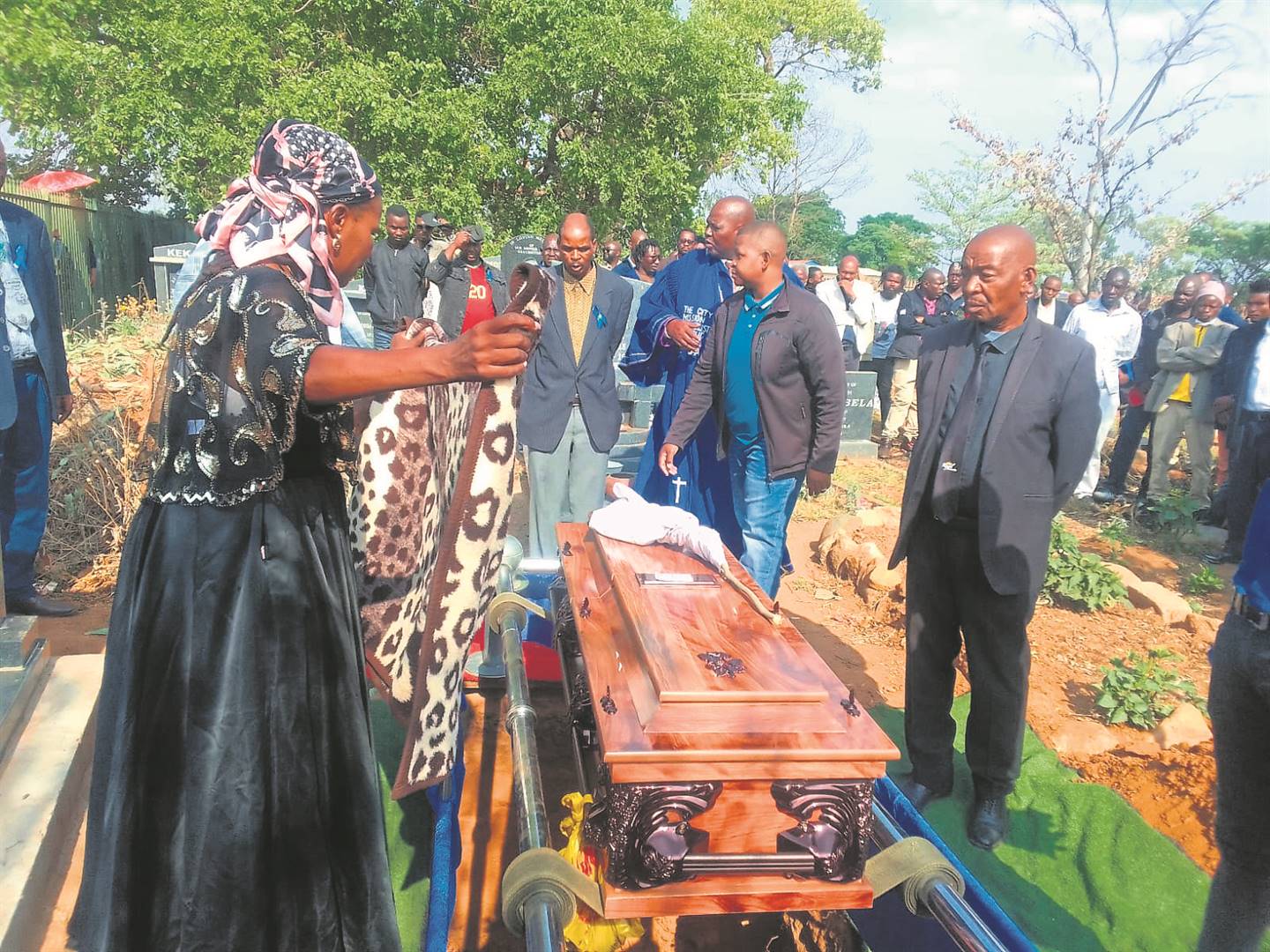 Mourners paying their last respects at the funeral of Amos Junior Ndlovu in Mandela Village on Sunday.    Photo by Raymond Morare