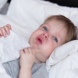 A child's cough is often worse when the child is lying in bed as the mucus can collect in the back of the throat.
