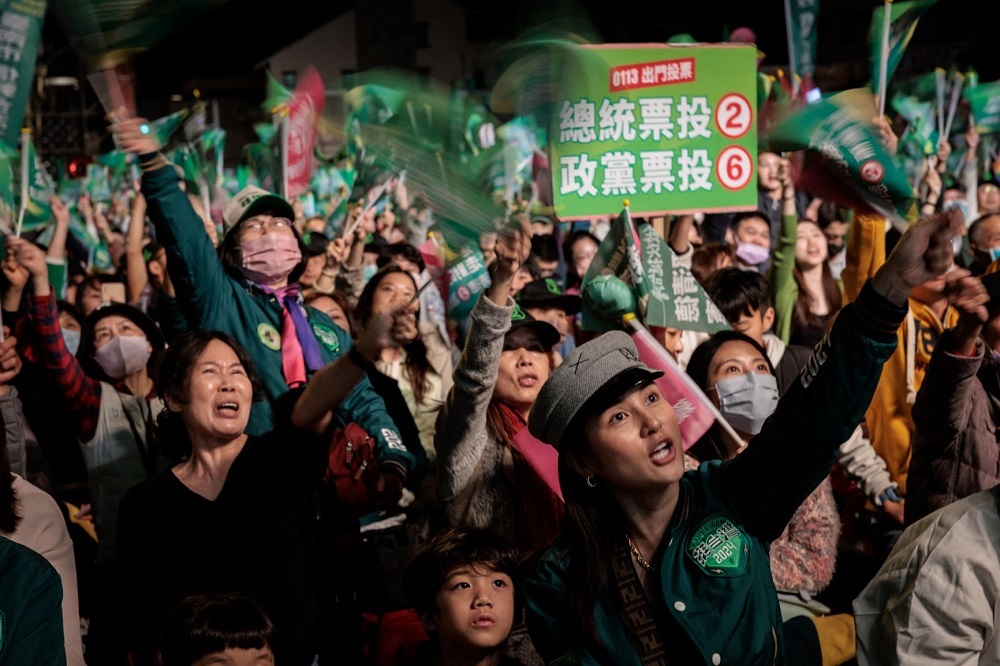 Supporters of the ruling Democratic Progressive Party (DPP) react during an election campaign rally in Tainan on 12 January 2024. 