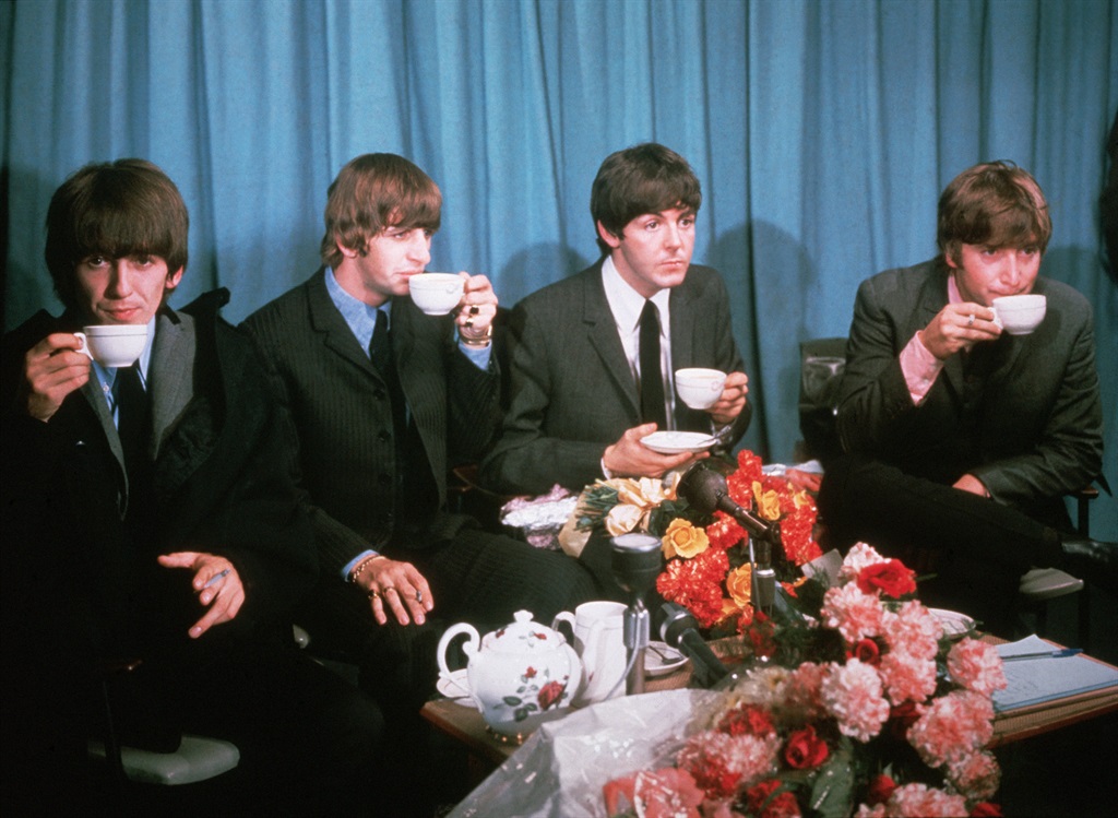 Beatles - drinking tea, 1960's. British pop group The Beatles drinking tea: (L-R) George Harrison, Ringo Starr, Paul McCartney, John Lennon. (Photo by © Hulton-Deutsch Collection/CORBIS/Corbis via Getty Images)