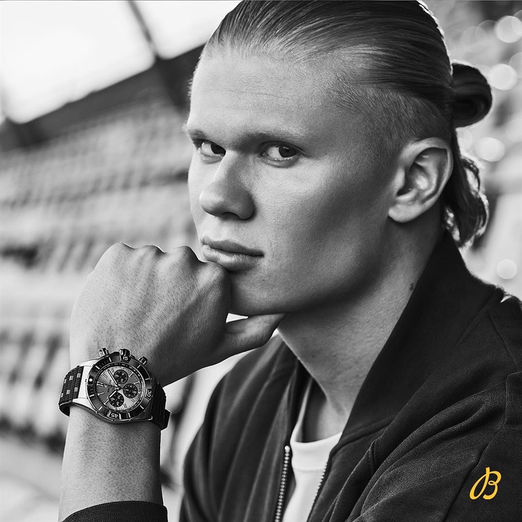 Erling Haaland posing with a Brietling watch for their new collection.