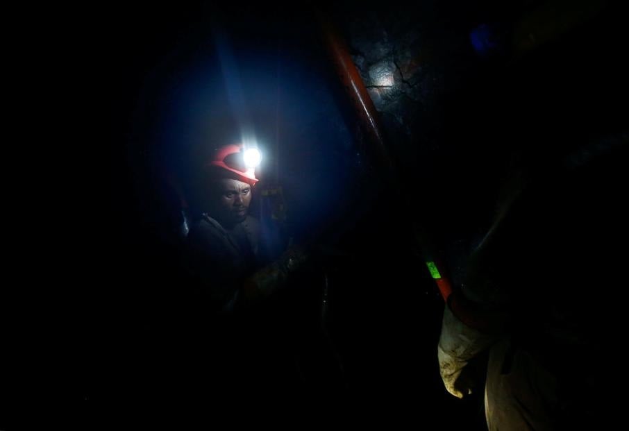 Mine workers employed at Sibanye Gold’s Masimthembe shaft operate a drill in Westonaria on April 3 2017. Picture: Mike Hutchings/Reuters