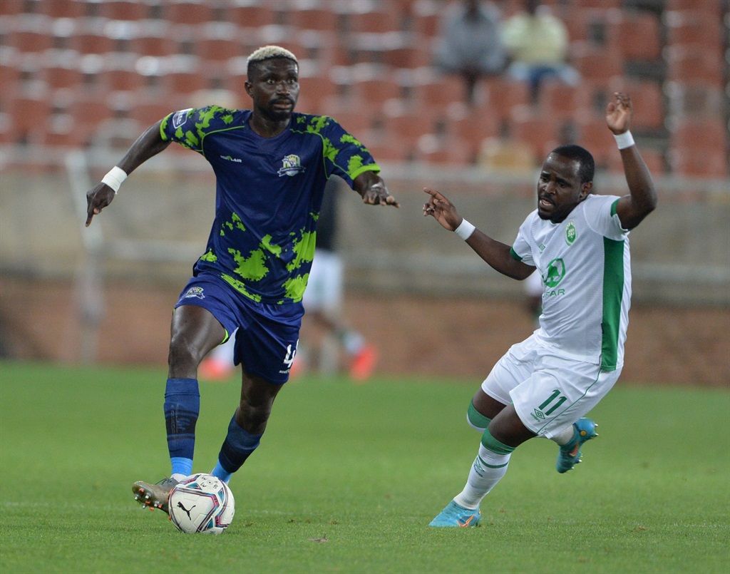 POLOKWANE, SOUTH AFRICA - OCTOBER 26: Olivier Toure of Marumo Gallants and Gabadihno Mhango of Amazulu FC during the DStv Premiership match between Marumo Gallants FC and AmaZulu FC at Peter Mokaba Stadium on October 26, 2022 in Polokwane, South Africa. (Photo by Philip Maeta/Gallo Images)