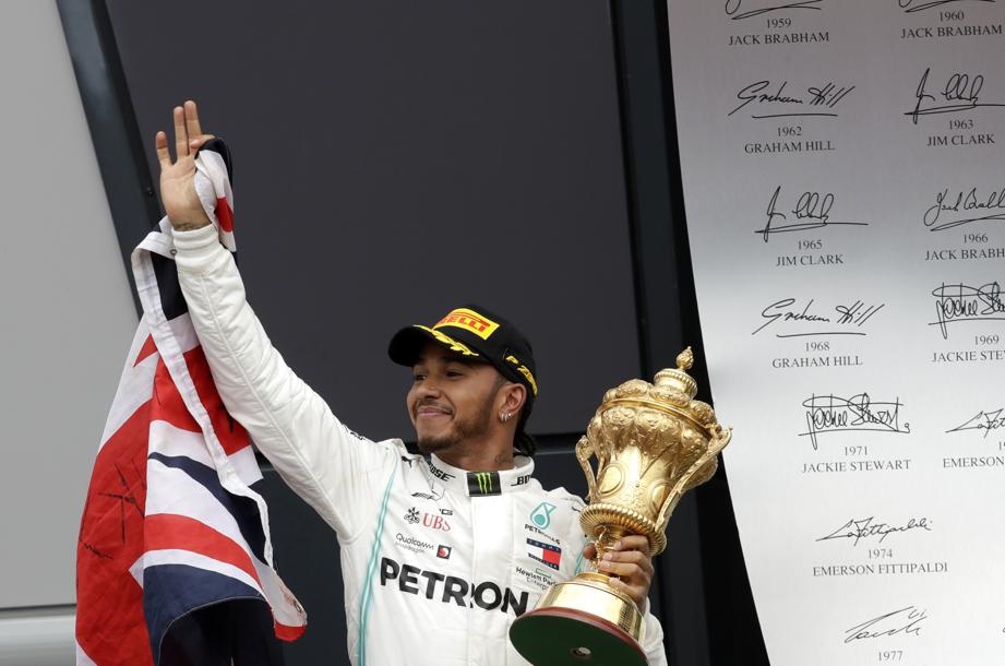 Mercedes driver Lewis Hamilton of Britain celebrates on the podium after winning the British Formula One Grand Prix at the Silverstone racetrack. Picture: Luca Bruno/AP