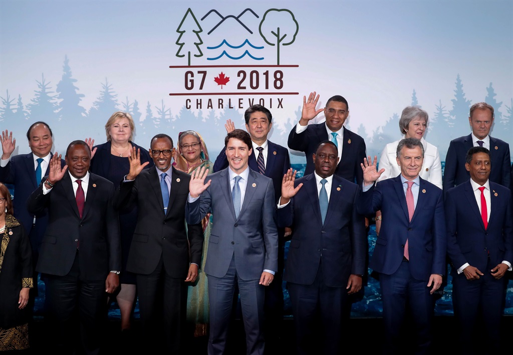 Attendees, including the host, Canada’s Prime Minister Justin Trudeau, pose for a G7 and outreach countries summit as part of a G7 summit in the Charlevoix city of La Malbaie, Quebecon June 9 2018. Picture: Yves Herman/Reuters