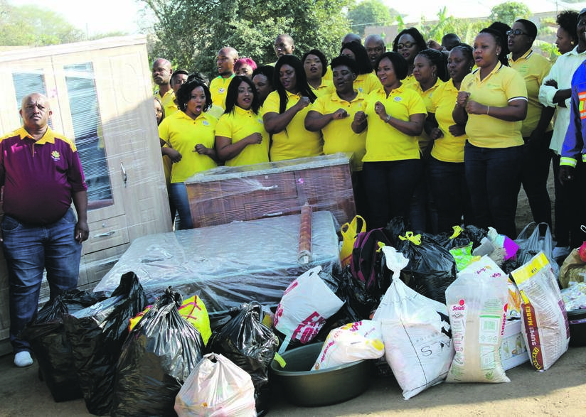 Choir donated food and furniture to family.  Photo by  Tlangelani Khosa