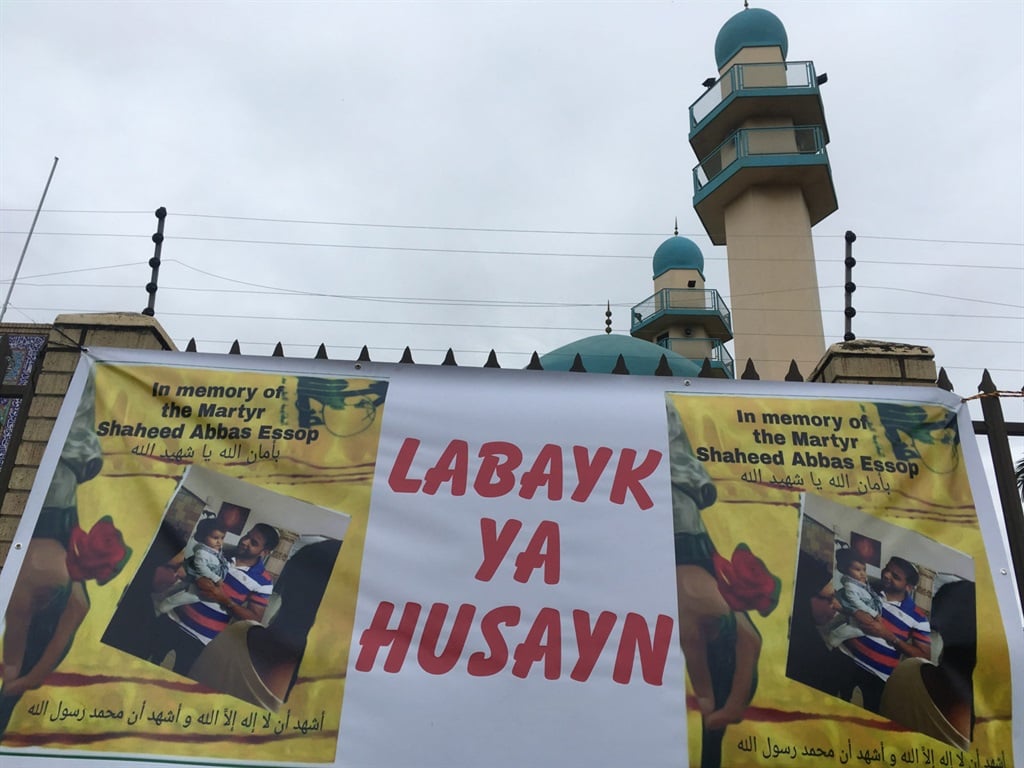 Shaheed Abbass Essop died in the attack at the mosque in Verulam. A banner hangs on the gate in his memory.