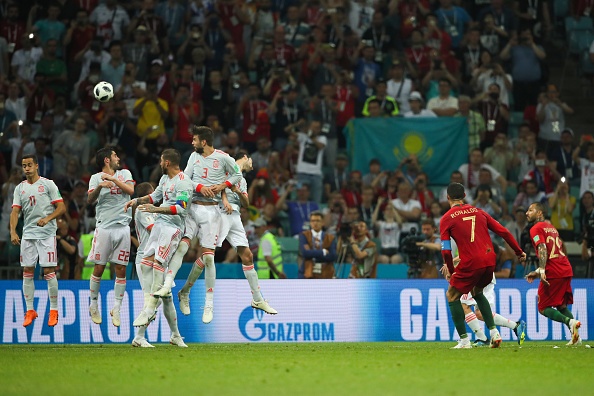 Cristiano Ronaldo of Portugal scores a goal to make it 3-3 against Spain during the 2018 FIFA World Cup Russia