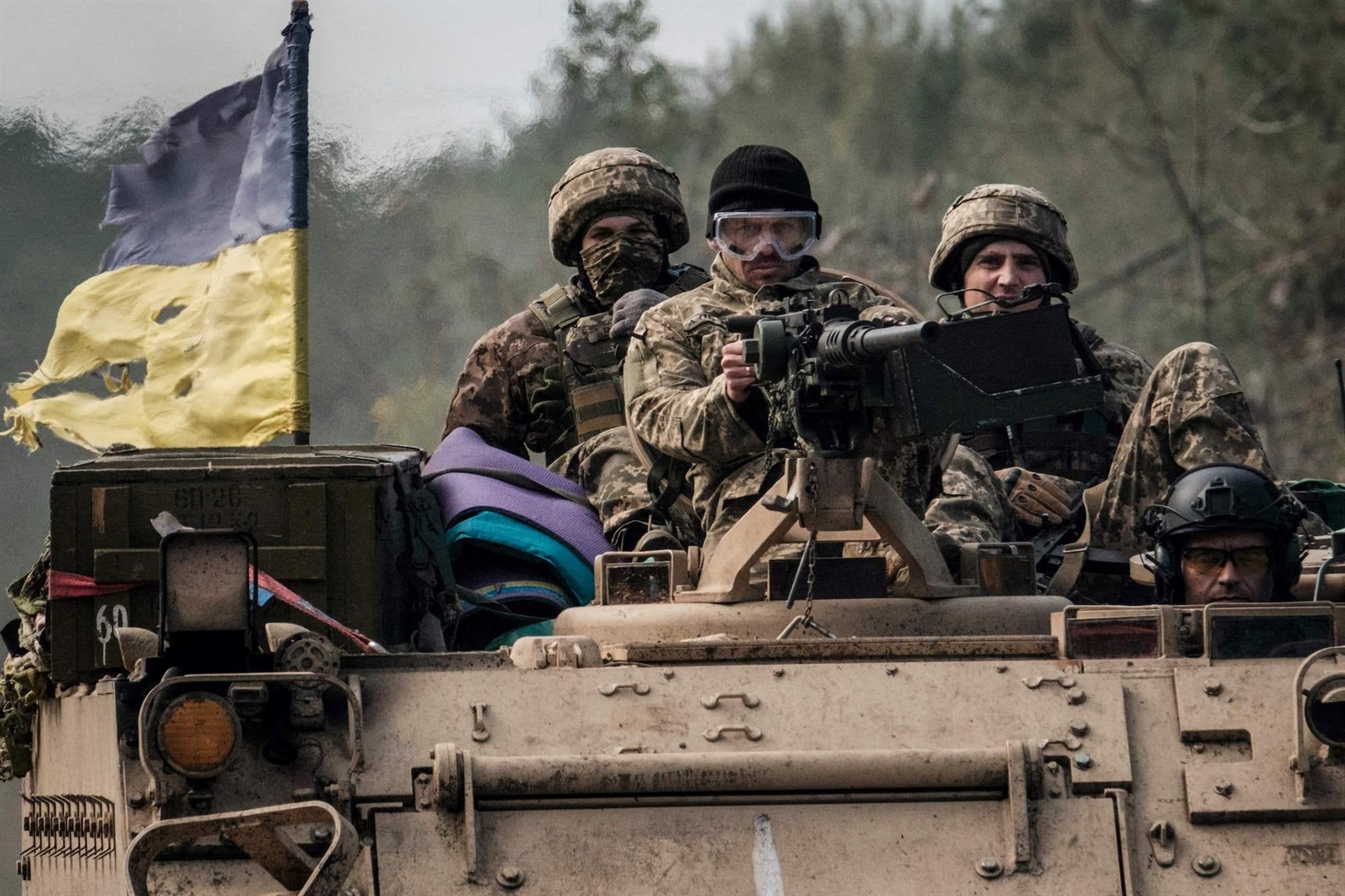 Ukrainian soldiers on an armored vehicle near Lyman on October 6.