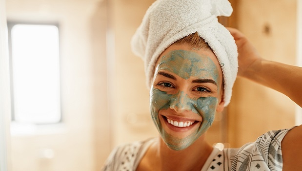 Woman with green face mask. 