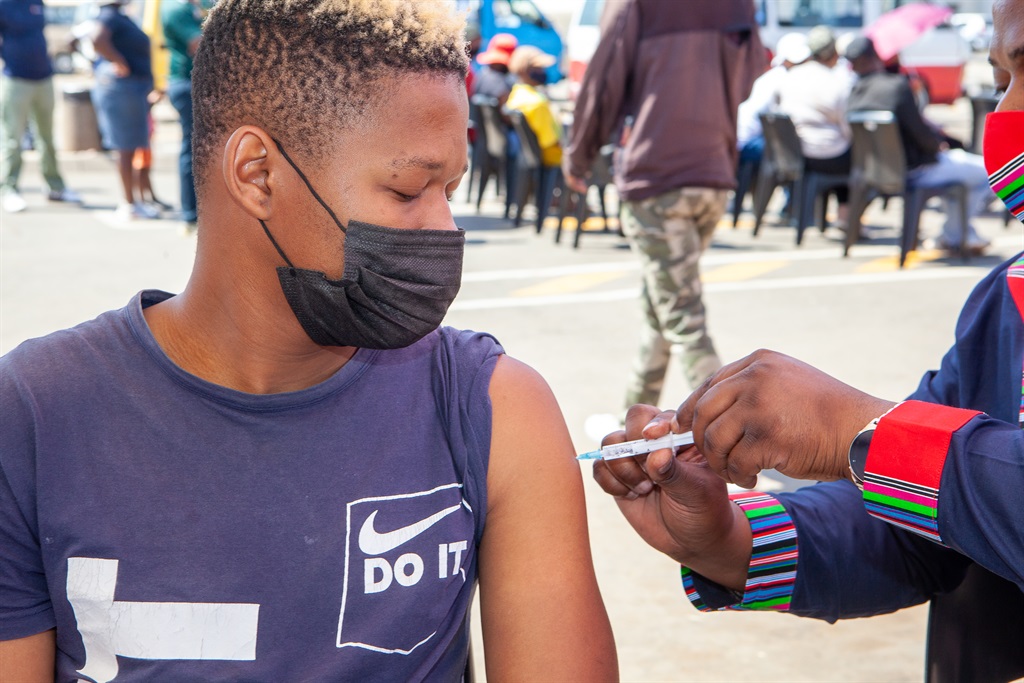 Citizens receive Covid-19 vaccination at the Jabulani Mall Taxi Rank Pop Up Vaccination Site.