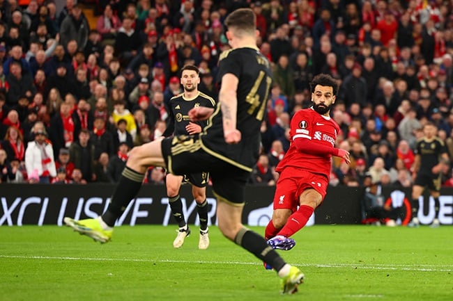 Liverpool's Mohamed Salah scores in the Europa League round of 16 second leg match against AC Sparta Praha at Anfield on 14 March 2024. (Photo by Chris Brunskill/Fantasista/Getty Images)