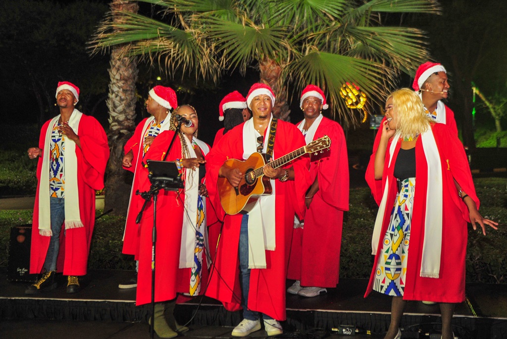  a choir in singing Christmas carols 