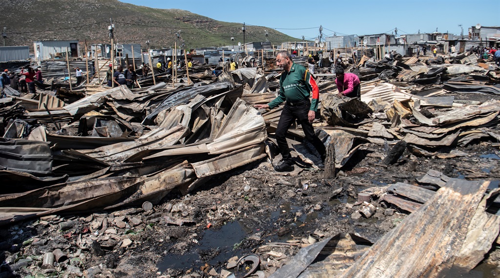 Gift of the Givers founder, Dr Imtiaz Sooliman, at the  Masiphumelele fire site on 1 November 2022.