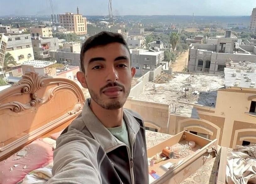 Ahmad Ghunaim taking a selfie in his home with no wall, after a bomb struck the building in October last year. (Supplied)