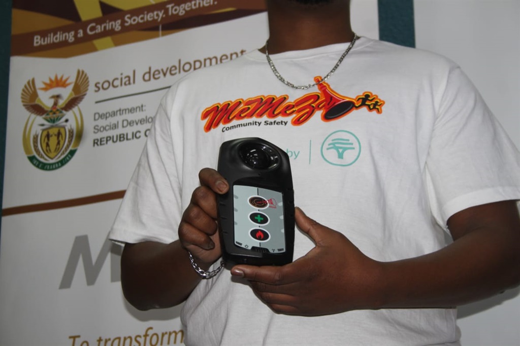 A representative from Gauteng social development department expaining how Memeza  Hope alarms works. Photo by Phineas Khoza