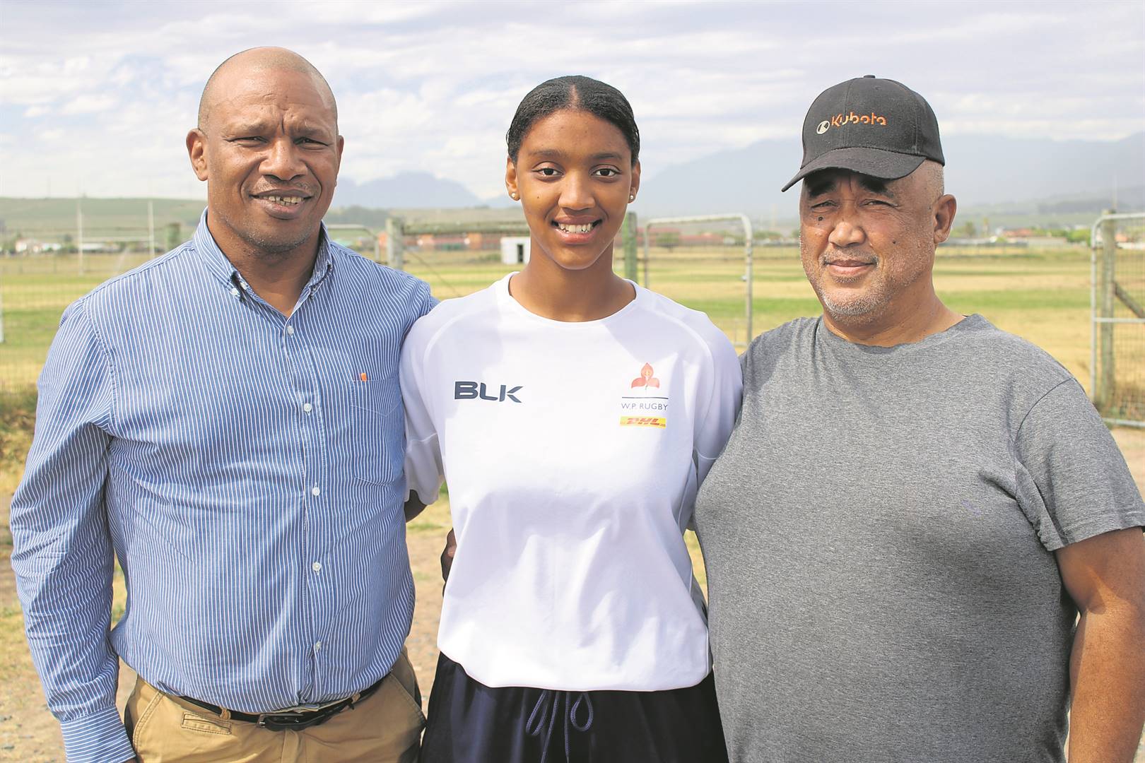 DHL WP Schools’ Player of the Year, Logan Welmann, is flanked by Riverside Girls’ Rugby Academy co-founder Godfrey Afrika and team manager Anthony Jackson.Photo: Yaseen Gaffar