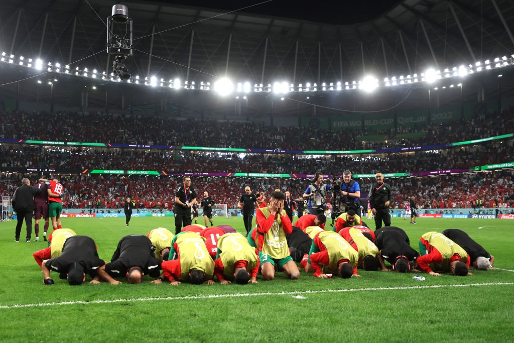 Morocco players celebrate after the teams victory in the penalty shootout against Spain (Photo by Catherine Ivill/Getty Images)