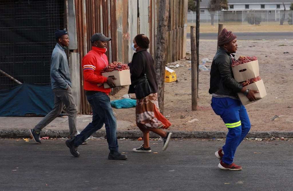 Informal traders buy fresh produce in bulk at the Cape Town Market to sell at their spaza shops in townships in Cape Town. (Photo by Gallo Images/Nardus Engelbrecht)