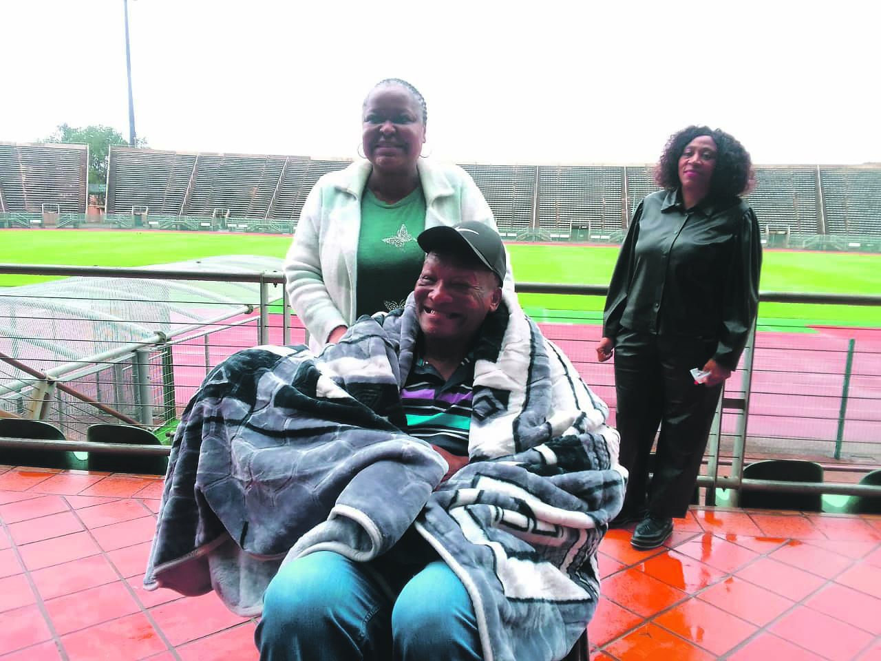 Tshwane MMC for social development and community services Peggy de Bruin pushes Lucas ‘Masterpieces’ Moripe in his new wheelchair at the Lucas Moripe Stadium in Atteridgeville on Tuesday, 8 November.­          Photo by            Raymond Morare