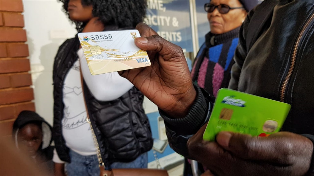 As people queue for hours to receive their grants, there is also confusion about which card to use. Picture: Tebogo Letsie/City Press