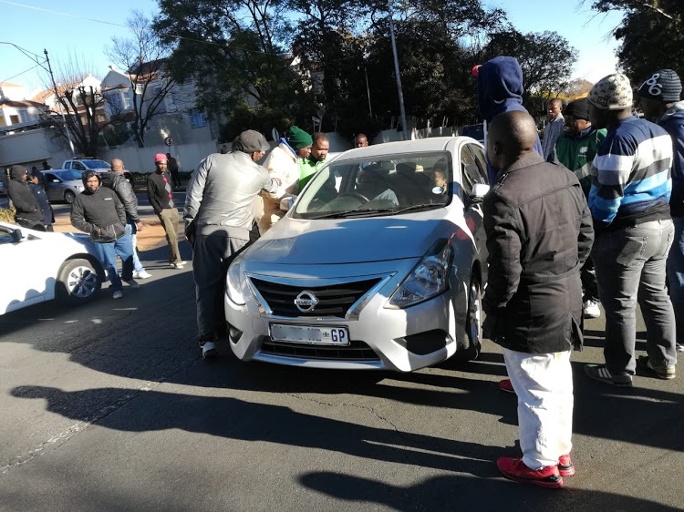 Uber and Taxify operators stop some of their fellow drivers near Zoo Lake in Johannesburg as they embark on a strike. Picture: Ernest Mabuza
