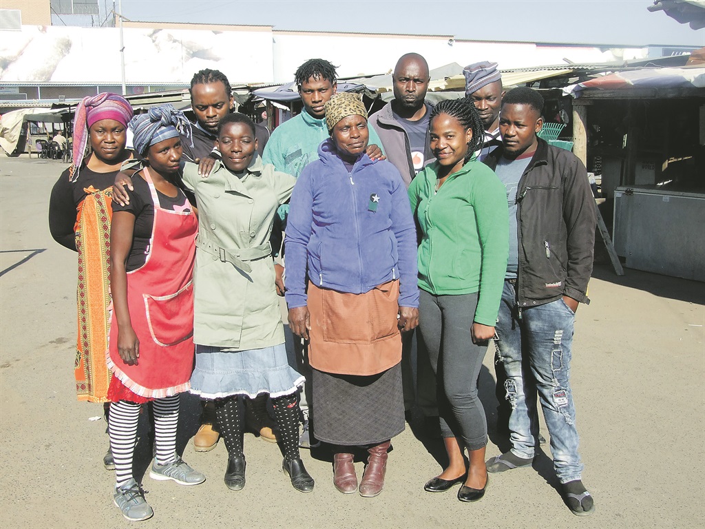 Some members of DND Social Club at their place of work, Mabopane Station, north of Tshwane.   Photo by Abel Mabena