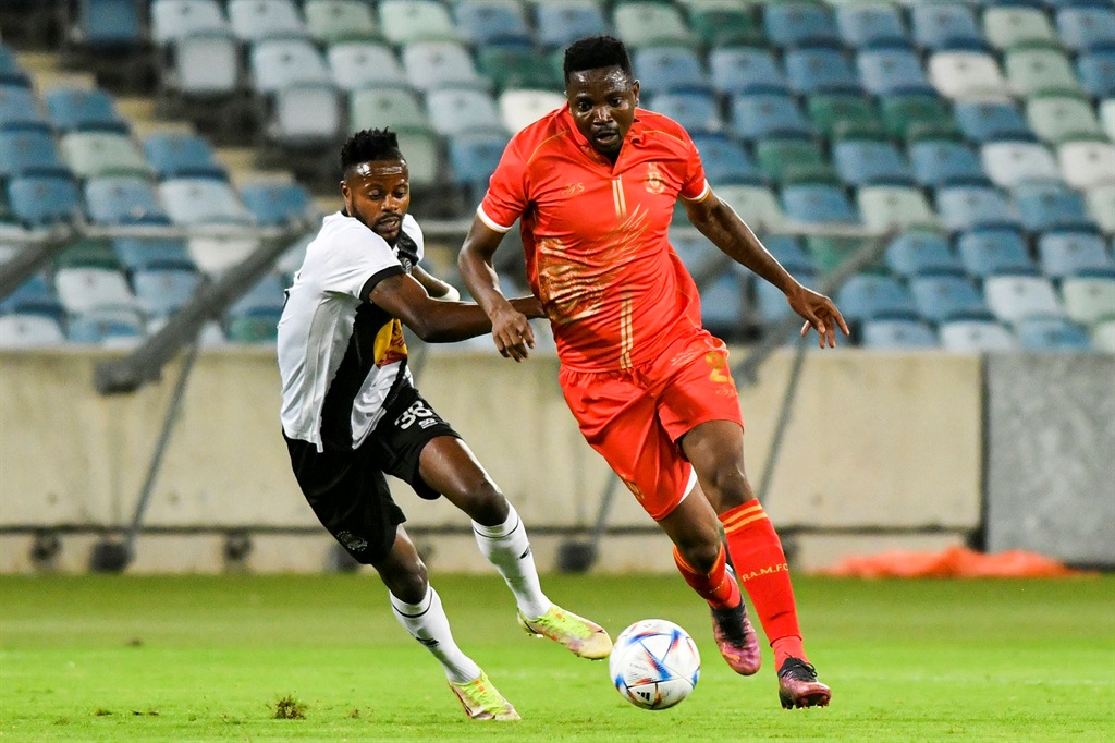 DURBAN, SOUTH AFRICA - NOVEMBER 09: Tshepo Rikhotso of Royal AM and Zao Matutala of TP Mazembe during the CAF Confederation Cup play-offs, leg 2 match between Royal AM and TP Mazembe at Moses Mabidha Stadium on November 09, 2022 in Durban, South Africa. (Photo by Darren Stewart/Gallo Images)