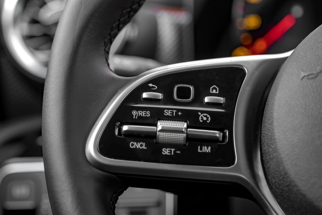 Close-up shot of electric car steering wheel cruis