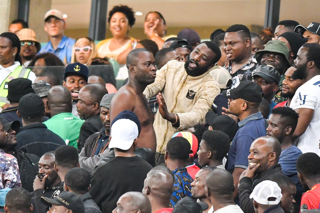 DURBAN, SOUTH AFRICA - NOVEMBER 09: Tussle in the crowd during the CAF Confederation Cup play-offs, leg 2 match between Royal AM and TP Mazembe at Moses Mabidha Stadium on November 09, 2022 in Durban, South Africa. (Photo by Darren Stewart/Gallo Images)