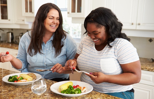 overweight women preparing healthy food