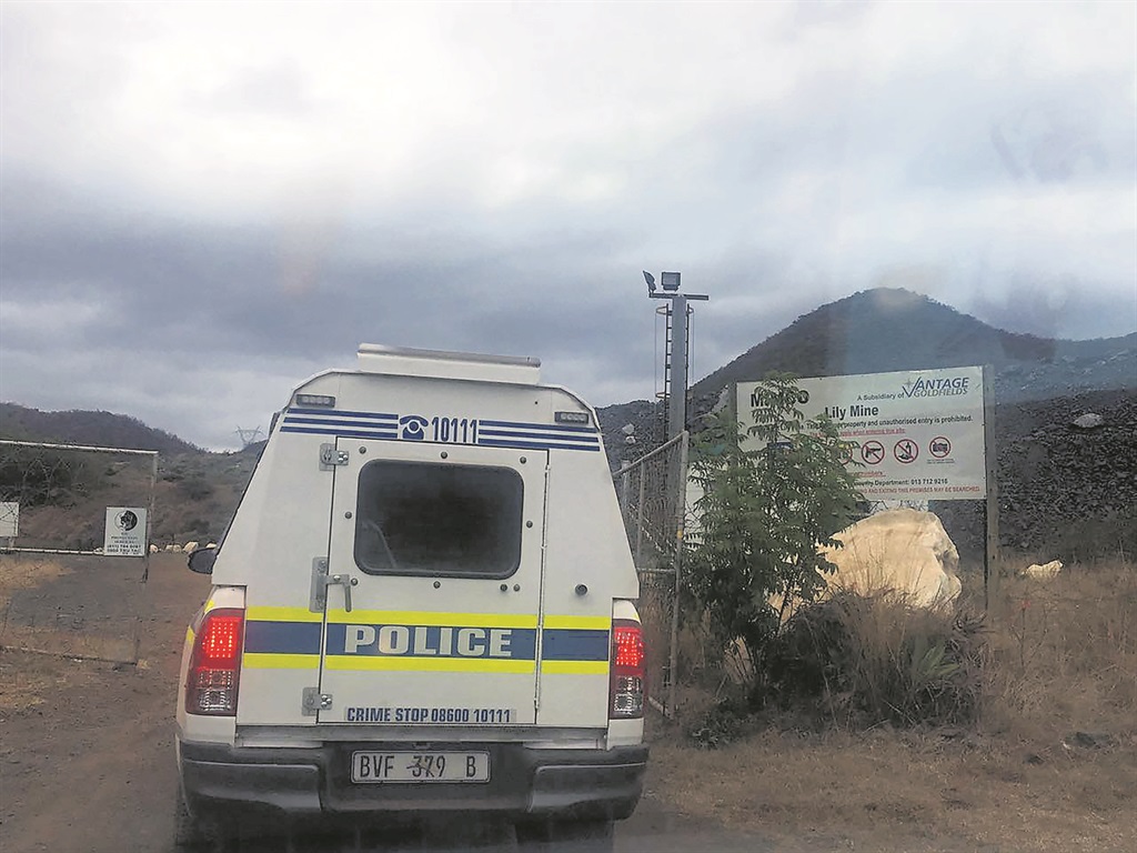 Police at the scene at Lily Mine where an illegal miner was killed.        Photo by Bulelwa Ginindza