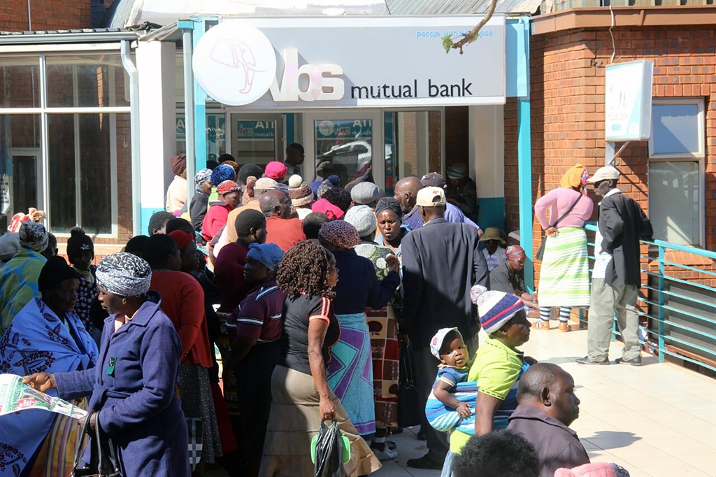 VBS clients, who are mostly elderly, keep vigil at the bank waiting to withdraw whatever money they could. Picture: Armando Chikhudo