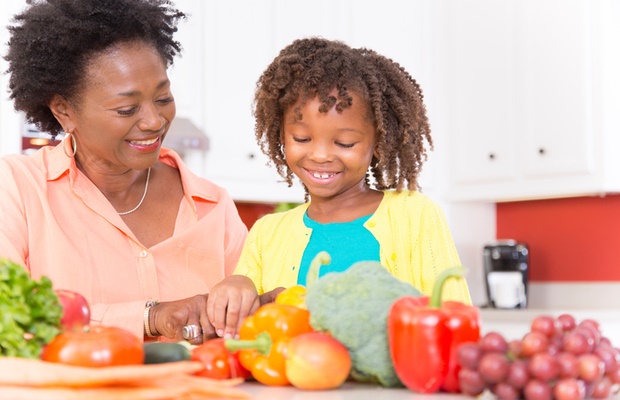 mother and child preparing healthy food 