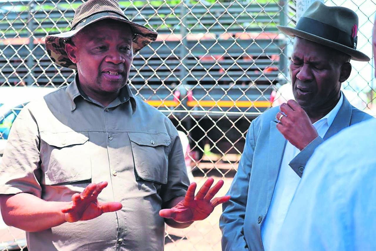 Pastor Piet Tlhabanyane and North West MEC for community safety Sello Lehari at the scene where a total of 47 suspected stolen cattle were recovered on Thursday. 
