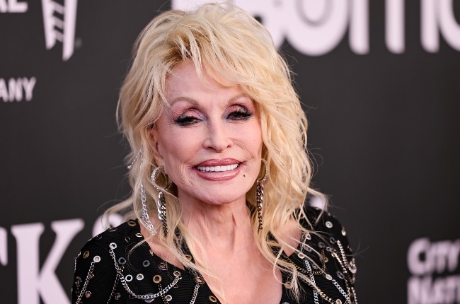 Dolly Parton's philanthropic work has caught the attention of US billionaire Jeff Bezos. (PHOTO: Getty Images)