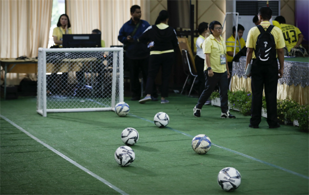 <p><em>A mini soccer field being set up before a press conference with the 12 boys and their coach who were rescued after being trapped in a flooded cave in northern Thailand. (Vincent Thian/AP)</em></p>