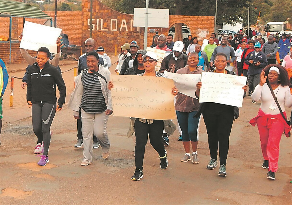 Left: MEC Dr Phophi Ramathuba was joined by hundreds of community members and health workers during an 11km walk on Wednesday.Photo by Desmond Boshego