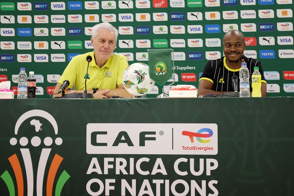 Hugo Broos and Percy Tau of South Africa during the 2023 Africa Cup of Nations press conference at Amadou Gon Coulibaly Stadium in Korhogo, Ivory Coast on 15 January 2024. 