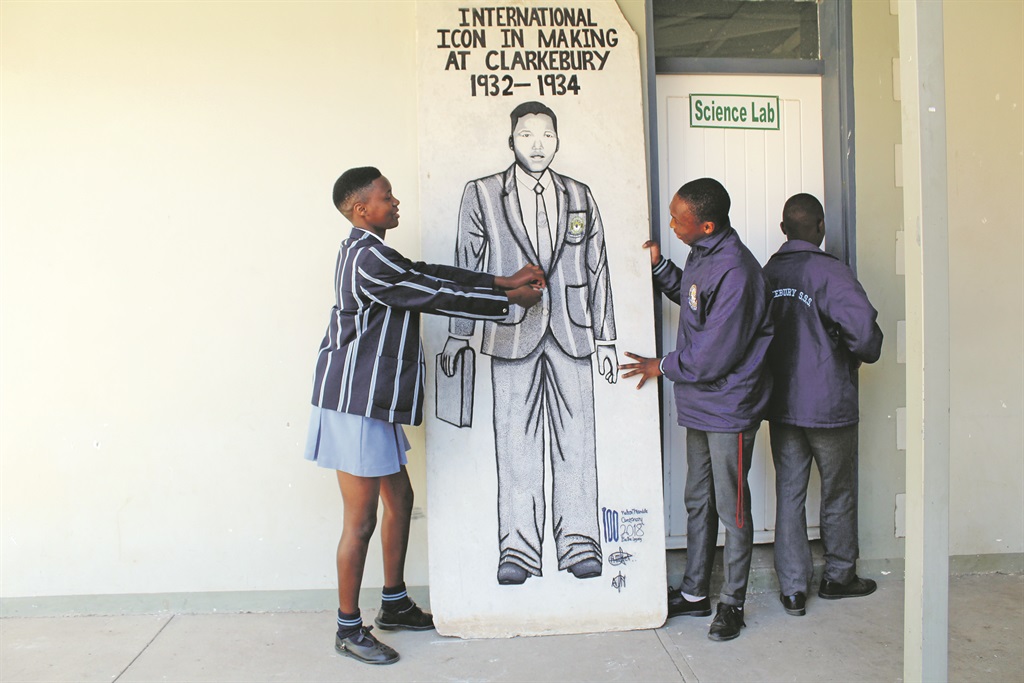 Songezo Sizani and Thokozani Siphondo look at a drawing of Nelson Mandela at Clarkebury High School. Photo by Ziyanda Zweni 