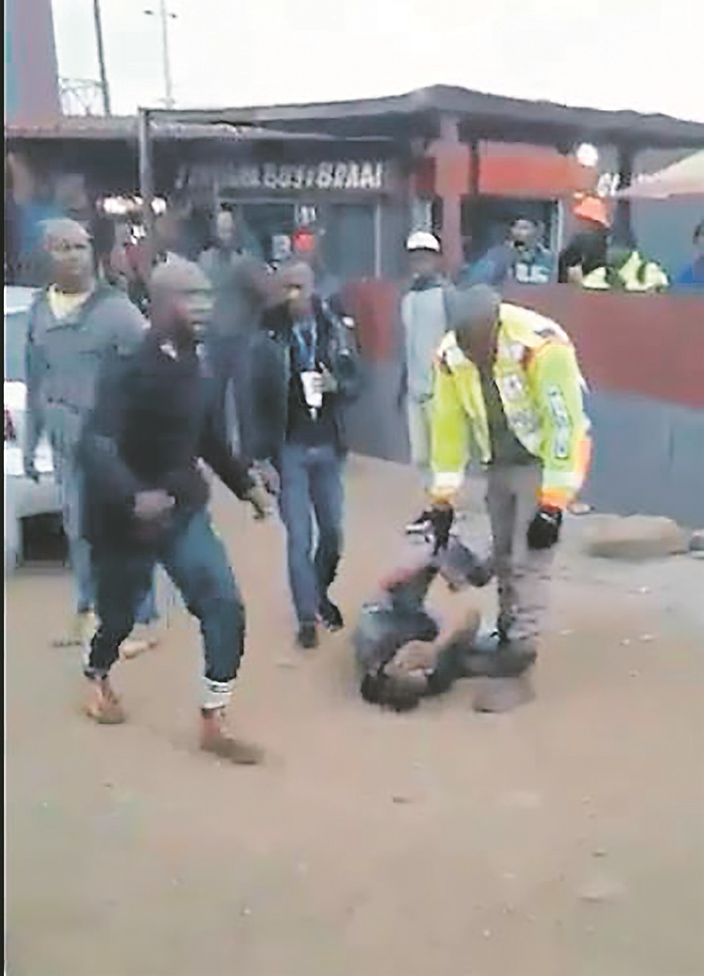 These screen shots from a video clip filmed last week show a Metro cop defending himself against a male attacker. 