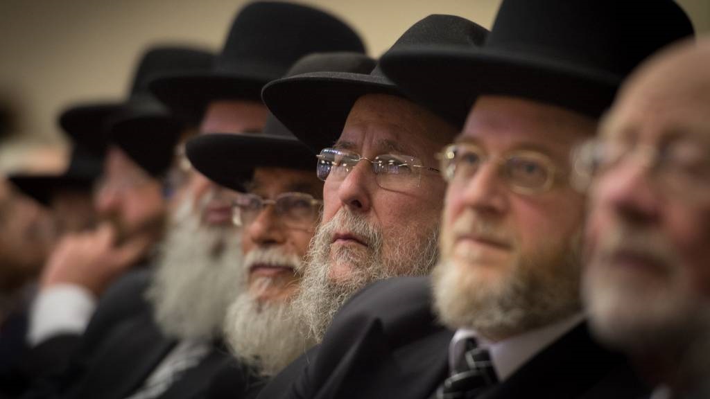 Rabbis and members of the Orthodox Jewish community attend the Installation of Chief Rabbi Ephraim Mirvis as the 11th Chief Rabbi of the United Hebrew Congregations of the UK and the Commonwealth during a ceremony at the St John's Wood Synagogue in north London.