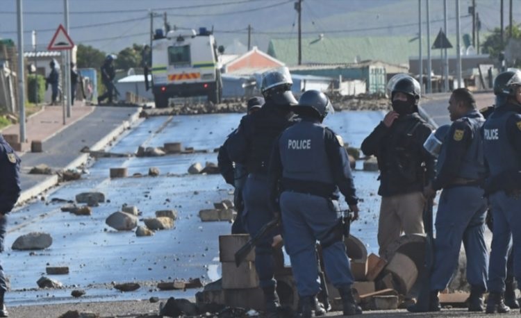 Zwelihle residents clash with police during a protest for the release of community activist Gcobani Ndzongana on July 13, 2018 in Hermanus. Picture: Brenton Geach
