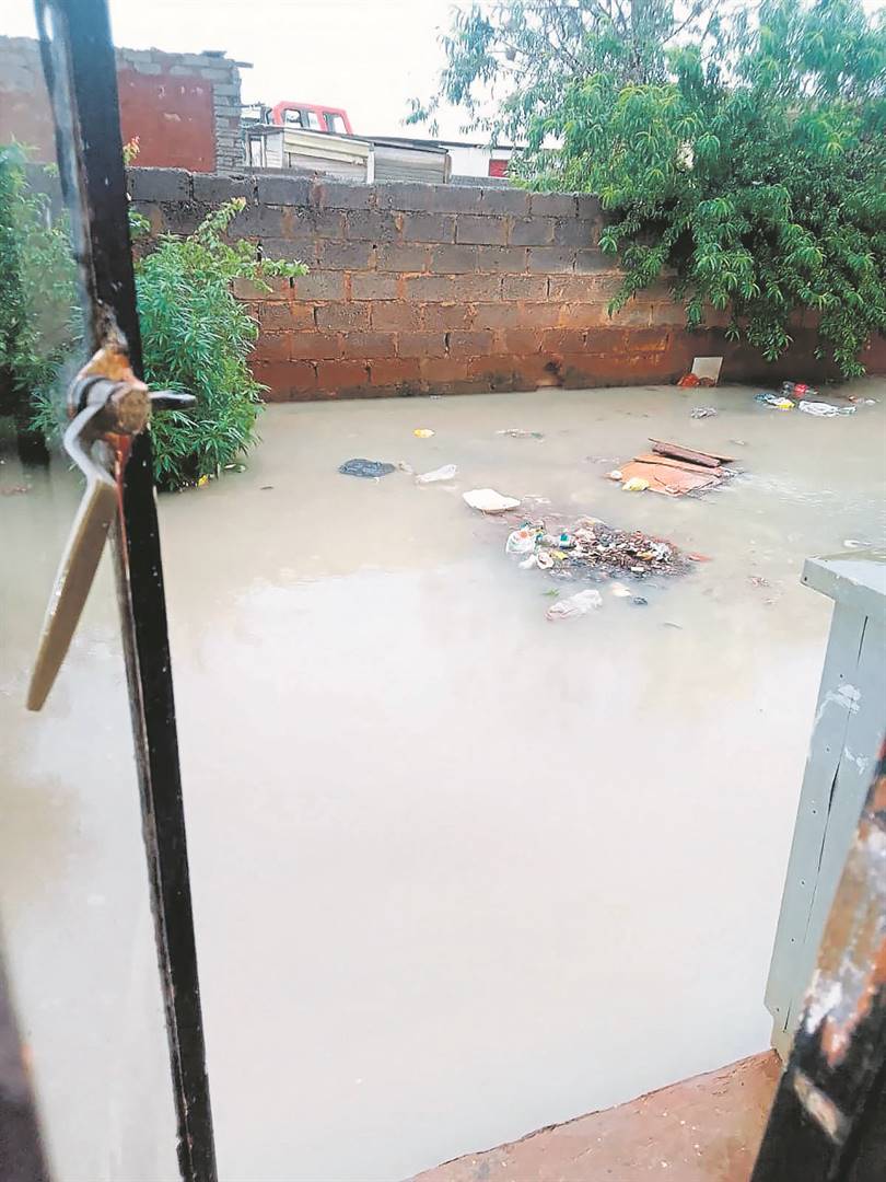 Sewage and waste in Thembi’s yard.