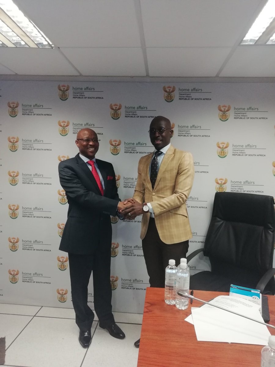 Mkuseli Apleni, former director general of home affairs with home affairs minister Malusi Gigaba at a media briefing in Pretoria. Picture: @SAgovnews/Twitter 