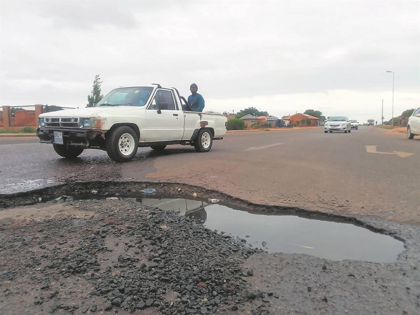Resident, Sakkie Maseko (37), from Winterveldt in Tshwane with other residents are complaining about a giant pothole in the middle of Molefe Makinta Highway in Winterveldt, residents are even calling it a swimming pool in the middle of the road. Photo by Raymond MorarePhoto by 