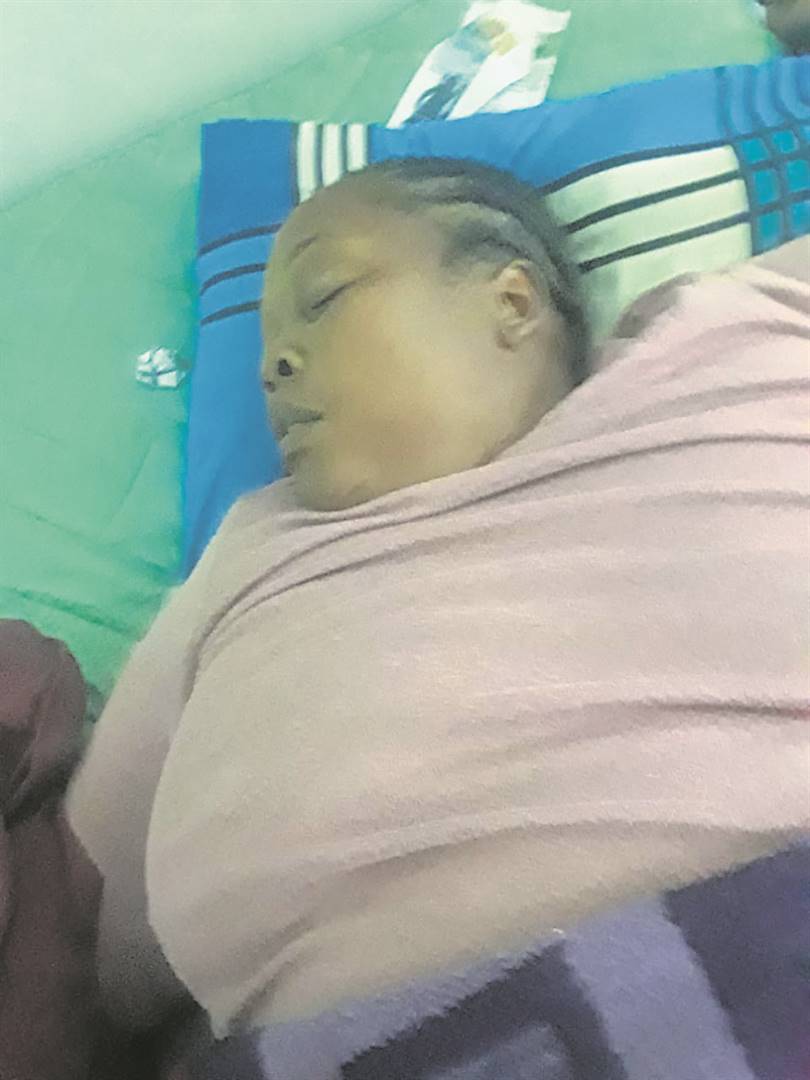 The case against Nomboleko Simayile, pictured lying on a bed after collapsing, was postponed.           Photo by Siyabonga Kamnqa
