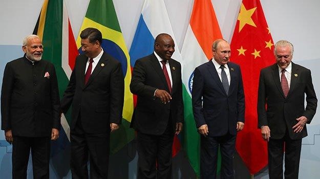From left, China's President Xi Jinping, India's Prime Minister Narendra Modi, SA President Cyril Ramaphosa, Brazil's President Michel Temer and Russia's President Vladimir Putin, pose for a group picture. (Mike Hutchings, AFP)