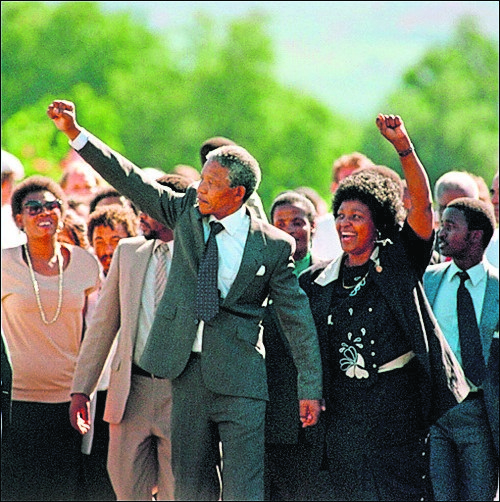 Nelson Mandela and Winnie Madikizela-Mandela celebrate his release from Victor Verster prison in 1990. Picture: Alexander Joe/AFP